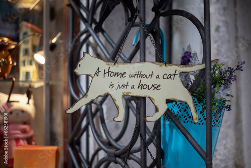 A cat lovers saying inscription decorating the entrance of a gift shop in Kotor Old Town, Montenegro