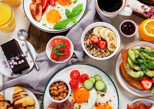 Healthy breakfast eating concept, various morning food on light background