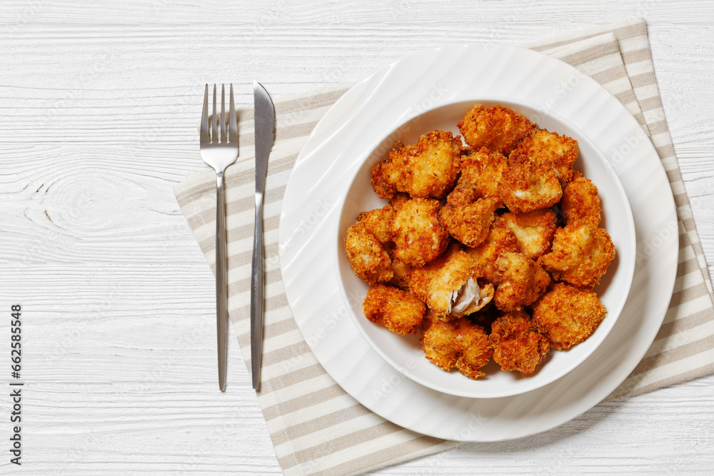crispy fried panko breaded chicken bites in bowl