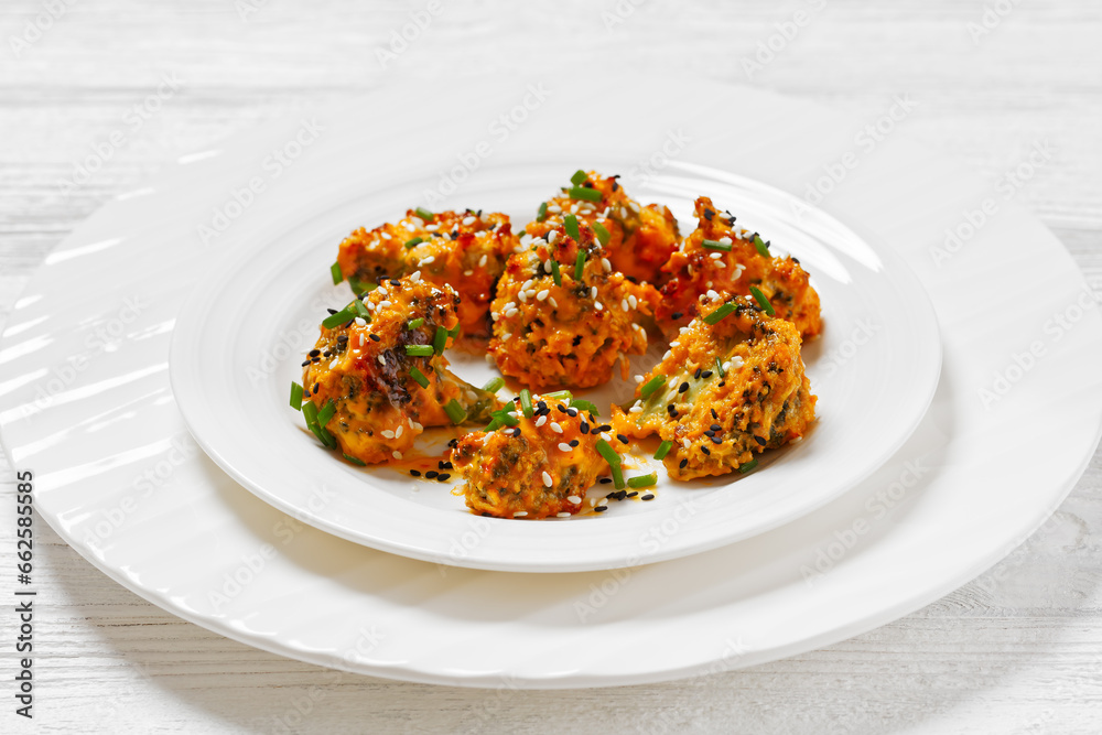 bang bang broccoli bites on plate, top view bang bang broccoli bites on plate, top view