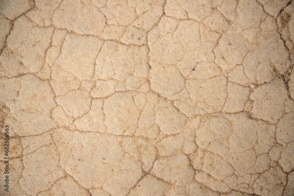 a close-up with dried beaten mud. Dry arid soil due to drought, climate change a close-up with dried beaten mud. Dry arid soil due to drought, climate change
