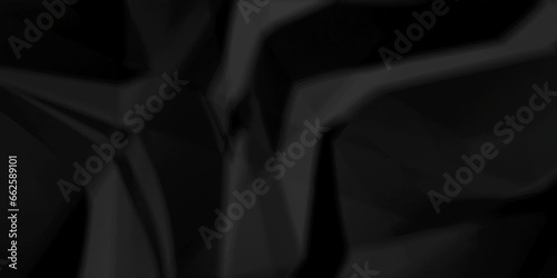 Crumpled paper texture. black crumpled paper texture. top view. crush paper so that it becomes creased and wrinkled. Old black crumpled paper sheet background texture.