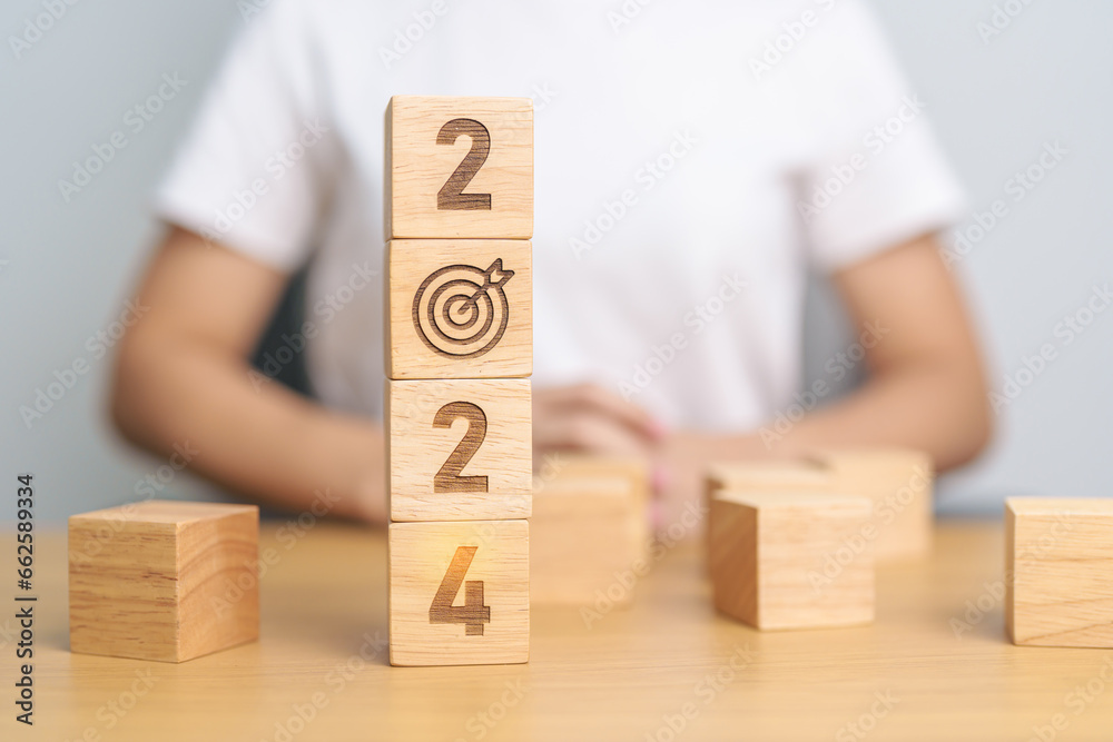 2024 block with dartboard sign. Business Goal, Target, Resolution, strategy, plan, Action motivation, mission, thinking, and New Year start concepts 2024 block with dartboard sign. Business Goal, Target, Resolution, strategy, plan, Action motivation, mission, thinking, and New Year start concepts