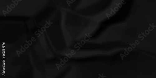 Dark crumple black fabric paper wrinkled poster template ,blank glued creased paper texture background. black paper crumpled backdrop background. used for cardboard and clerkboard.