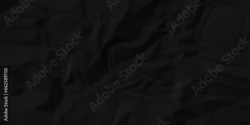 Dark crumple black fabric paper wrinkled poster template ,blank glued creased paper texture background. black paper crumpled backdrop background. used for cardboard and clarkboard.