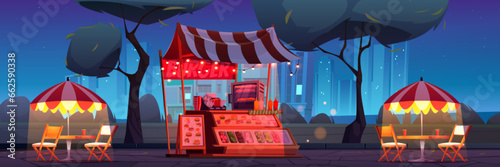 Outdoor burger stall in night city park. Vector cartoon illustration of fast food shop with menu, oven, chairs, tables under umbrella, garland lights decoration, dark cityscape background, starry sky
