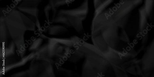 Crumpled black paper texture. Black crumpled paper texture crush paper. creased and wrinkled. Old dark black crumpled paper sheet background texture.	
