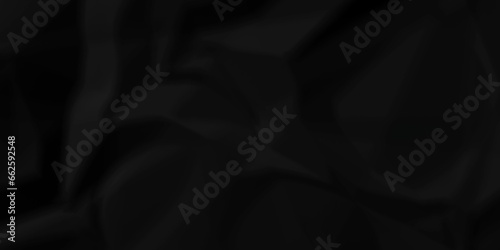 Dark crumple black fabric paper wrinkled poster template ,blank glued creased paper texture background. black paper crumpled backdrop background. used for cardboard and clarkboard.