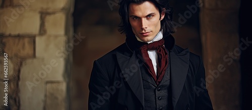 Dashing vampire in tailcoat at medieval castle Halloween With copyspace for text