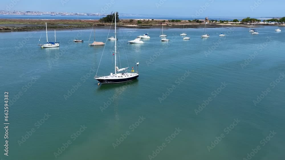 Drone shot of som anchored sailboats.