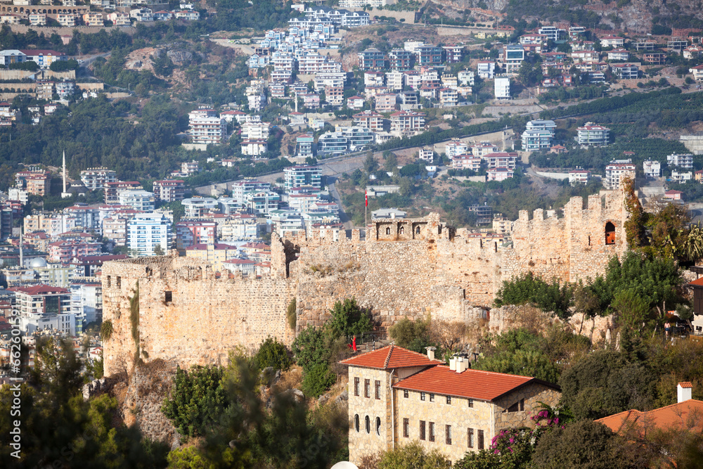 Alanya fortress on a rocky peninsula. View of the fortifications and the city of Alanya. Turkey