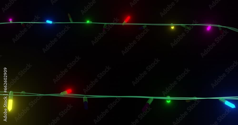 Coloured christmas string lights flashing on black background, copy space