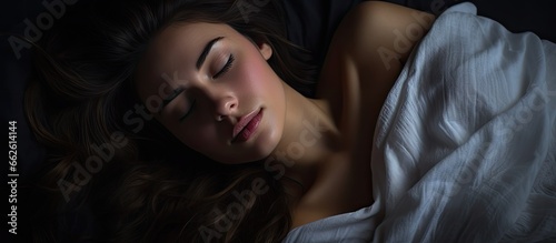 Beautiful girl peacefully sleeping under moonlight With copyspace for text
