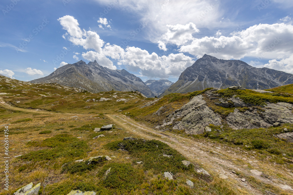 Mountain ranges of the Cottian Alps in the Petit Mont-Cenis Valley at south of the most important hill of Mont- Cenis, France Mountain ranges of the Cottian Alps in the Petit Mont-Cenis Valley at south of the most important hill of Mont- Cenis, France