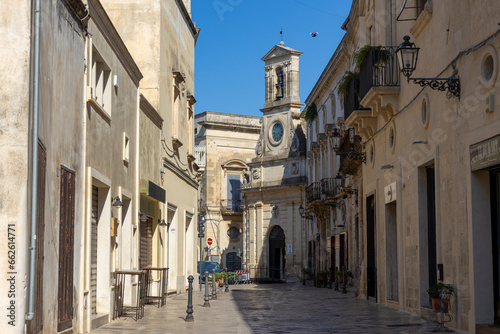 GALATINA, ITALY, JULY 16, 2022 - View of the ancient clock tower in the center town of Galatina, province of Lecce, Puglia, Italy
