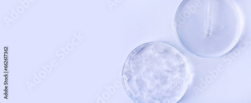 glass pipette serum gel closeup in petri dish on a light background with space for text © Екатерина Клищевник