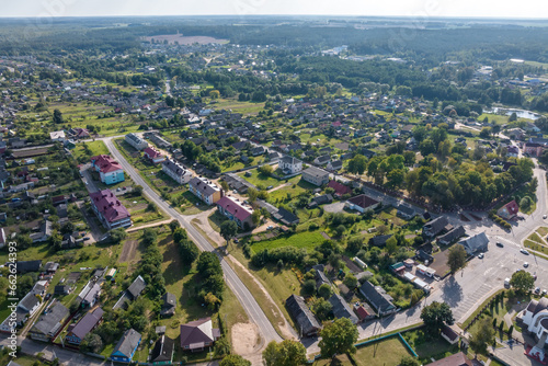 aerial view on provincial city or big village housing area with many buildings, roads and garden. © hiv360
