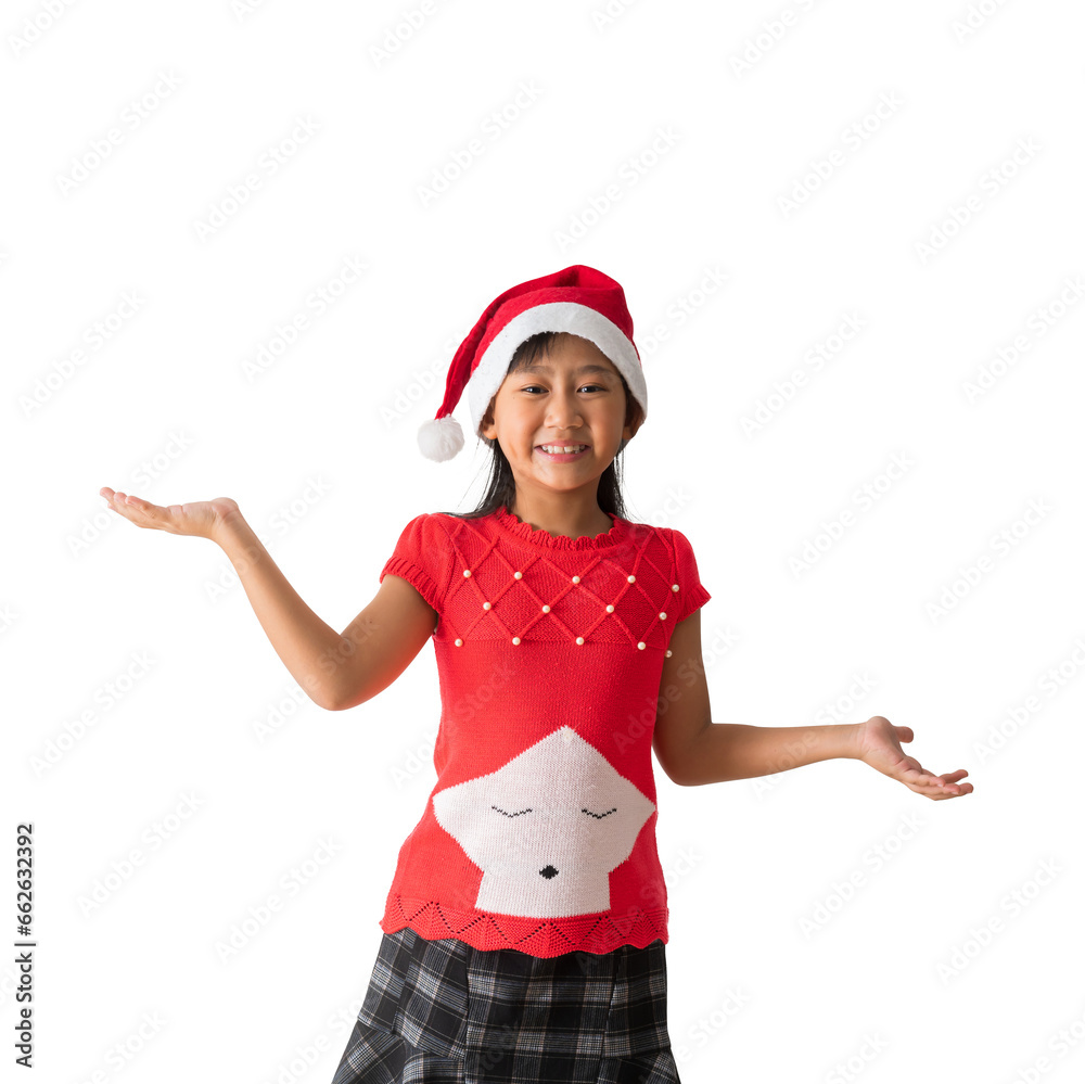 Portrait of cheerful happy Asian little girl Girl in santa hat Holding hands surprise standing posing, isolated on yellow background Portrait of cheerful happy Asian little girl Girl in santa hat Holding hands surprise standing posing, isolated on yellow background