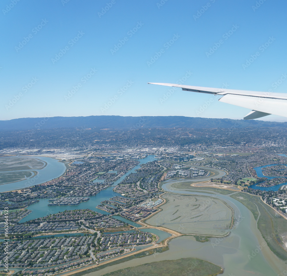 Aerial view of San Francisco from airplane window seat. USA. Vertical format.