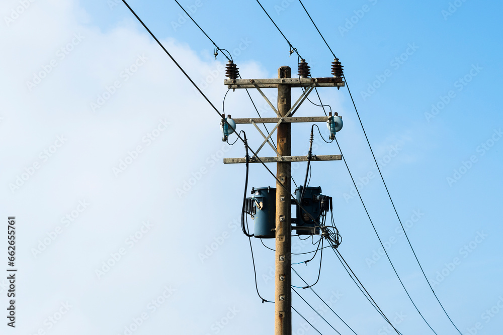 View of Telephone poles with blue sky and white clouds as a background View of Telephone poles with blue sky and white clouds as a background