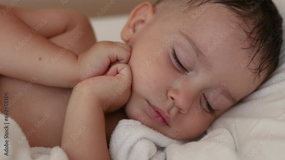 adorable cute baby boy sleeping in bedroom with both hands under cheek chin, sweet face. child kid covered with blanket, close up infant toddler feet. long lashes big lips, adorable portrait. adorable cute baby boy sleeping in bedroom with both hands under cheek chin, sweet face. child kid covered with blanket, close up infant toddler feet. long lashes big lips, adorable portrait.