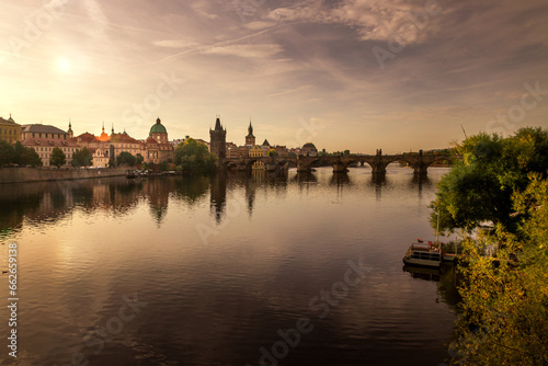 Autumn views from Prague. Picturesque autumn Prague in the morning sun. The Vltava River with the Charles Bridge  the waterfront and houses of Mala Strana and the dominant Prague Castle. Czechia