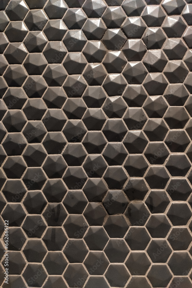 Texture of glossy black mosaic tiles hexagon