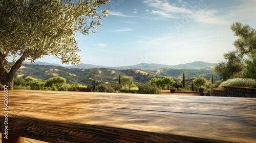 Massive wooden table for product placement with rustic olive oil farm background scene.