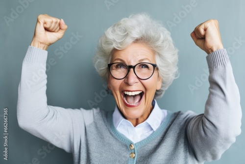 happy elderly woman rejoices at a successful project