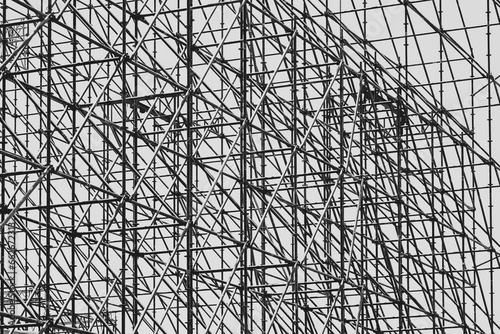 Large metal scaffolding of a stage, monochrome image.