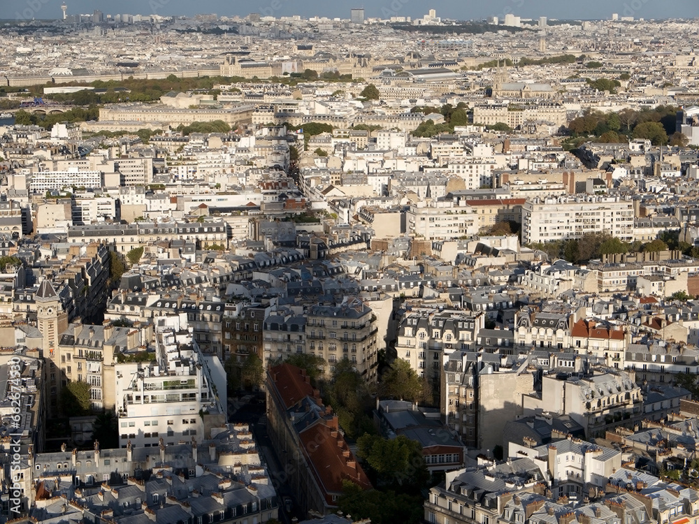 Paris cityscape from the Eiffel Tower, France with the shadow of the tower on the buildings