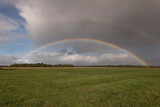 Double rainbow over monotone grassland