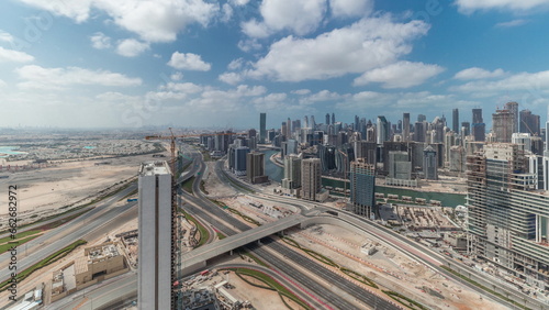 Panorama showing skyline of Dubai with business bay and downtown district timelapse. photo