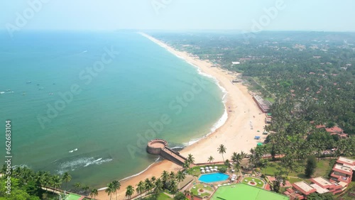 Goa, India: Aerial view of Indian summer resort by Arabian Sea, famous Sinquerim Beach and Sinquerim Fort - landscape panorama of South Asia from above photo