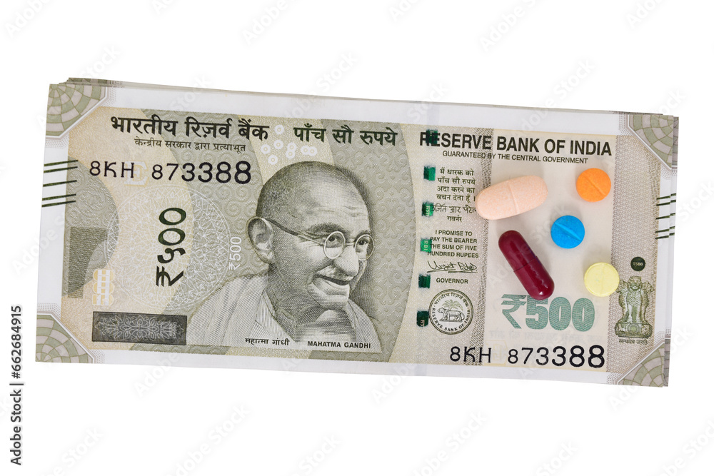 Indian currency note with medicine isolated on white background with cutout Indian currency note with medicine isolated on white background with cutout