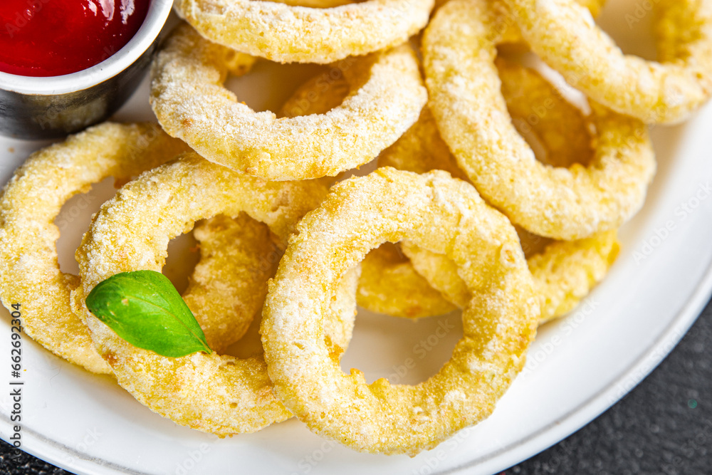 onion rings in batter deep fryer tomato sauce fast food delicious eating cooking appetizer meal food snack on the table copy space onion rings in batter deep fryer tomato sauce fast food delicious eating cooking appetizer meal food snack on the table copy space