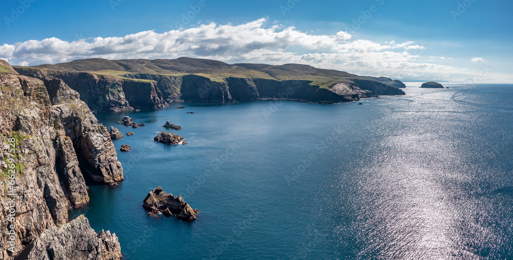 Aerial view of the cliffs near the lighthouse on the island of Arranmore in County Donegal, Ireland - obrazy, fototapety, plakaty 