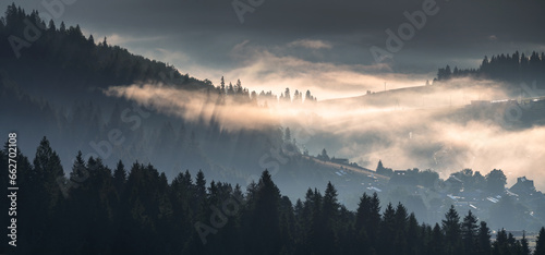 Fototapeta Naklejka Na Ścianę i Meble -  Beautiful sunrise in the picturesque mountains. Picturesque mists rolling in the valleys illuminated by the rays of the rising sun,Pieniny,Poland