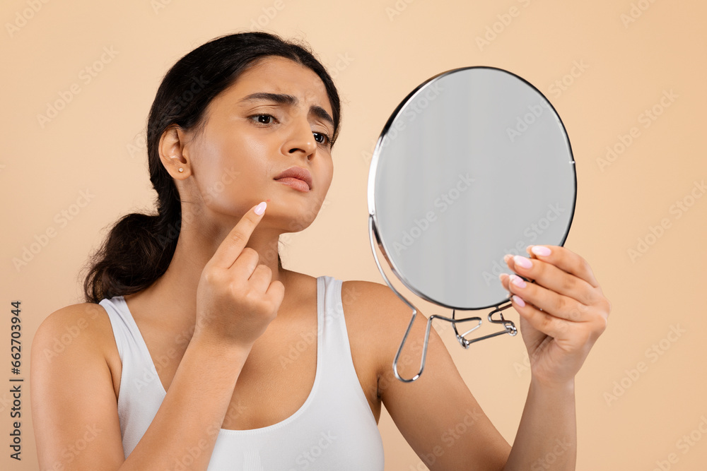 Skin Problems. Indian Woman Holding Mirror And Looking At Pimple On Chin Skin Problems. Indian Woman Holding Mirror And Looking At Pimple On Chin