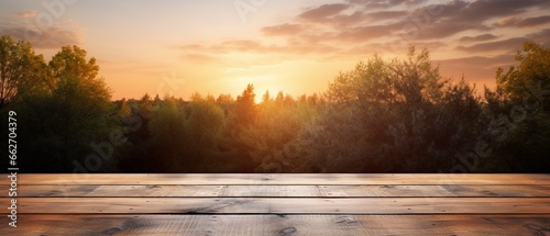 Empty Wooden Table with Blurred Forest Sunset Sky Background