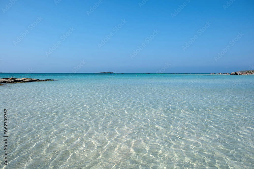 Elafonisi beach, Crete island Greece. Pink sand, shallow calm water, summer destination. Elafonisi beach, Crete island Greece. Pink sand, shallow calm water, summer destination.