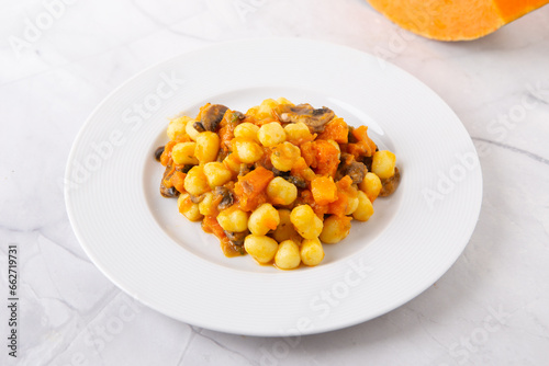 Gnocchi with pumpkin and mushrooms. Healthy and vegetarian autumn dish.