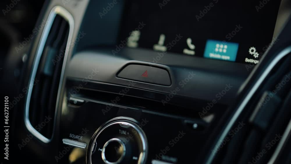 Close-up of Pushing an Emergency Button in the Car. Automobile Interior Inside Close-up of Pushing an Emergency Button in the Car. Automobile Interior Inside