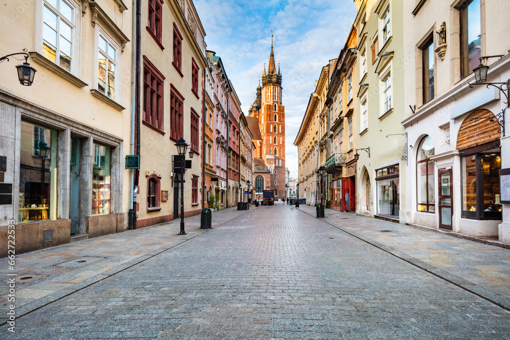 Old town street in Cracow, Poland with St. Mary's Basilica - obrazy, fototapety, plakaty 