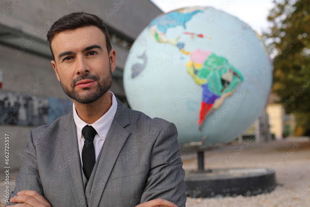 Businessman with the planet earth on the background Businessman with the planet earth on the background