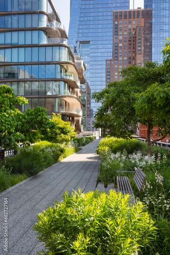 Fototapeta Naklejka Na Ścianę i Meble -  The High Line Park promenade on summer morning. Elevated greenway in Chelsea, Manhattan. New York City