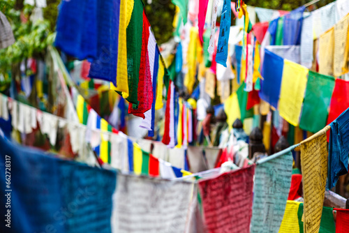 Colorful prayer flags on a bridge at Burning Lake a religious site in Jakar, Bumthang Valley, Bhutan, Asia © jeeweevh