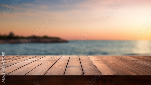 Empty light wood table top perspective and blurred sea background at sunset..