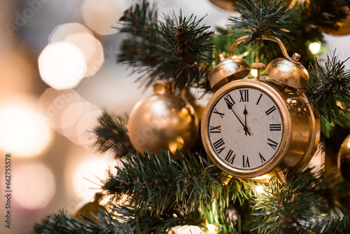 Countdown to midnight. The hours of the last moments before the New Year. The hands of the clock at five minutes to 12. Beautiful background for New year or Christmas 2024.