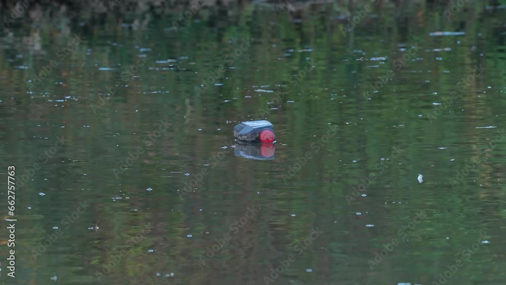 Garbage and plastic waste float on water - (4K) Garbage and plastic waste float on water - (4K)